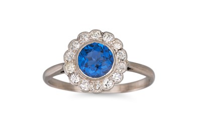 Lot 166 - A SAPPHIRE AND DIAMOND CLUSTER RING, the...