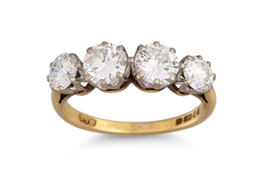 Lot 223 - A FOUR STONE DIAMOND RING, the brilliant cut...