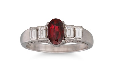 Lot 228 - A RUBY AND DIAMOND RING, the oval ruby to...