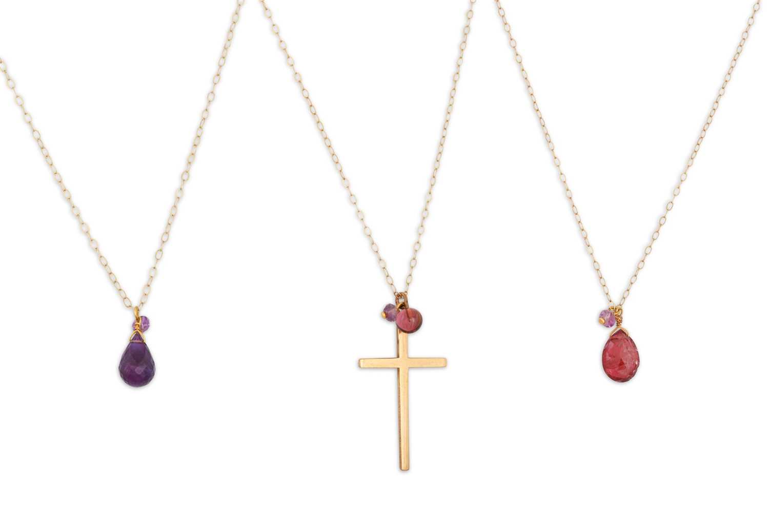 Lot 44 - THREE 9CT GOLD NECKLACES suspending various...