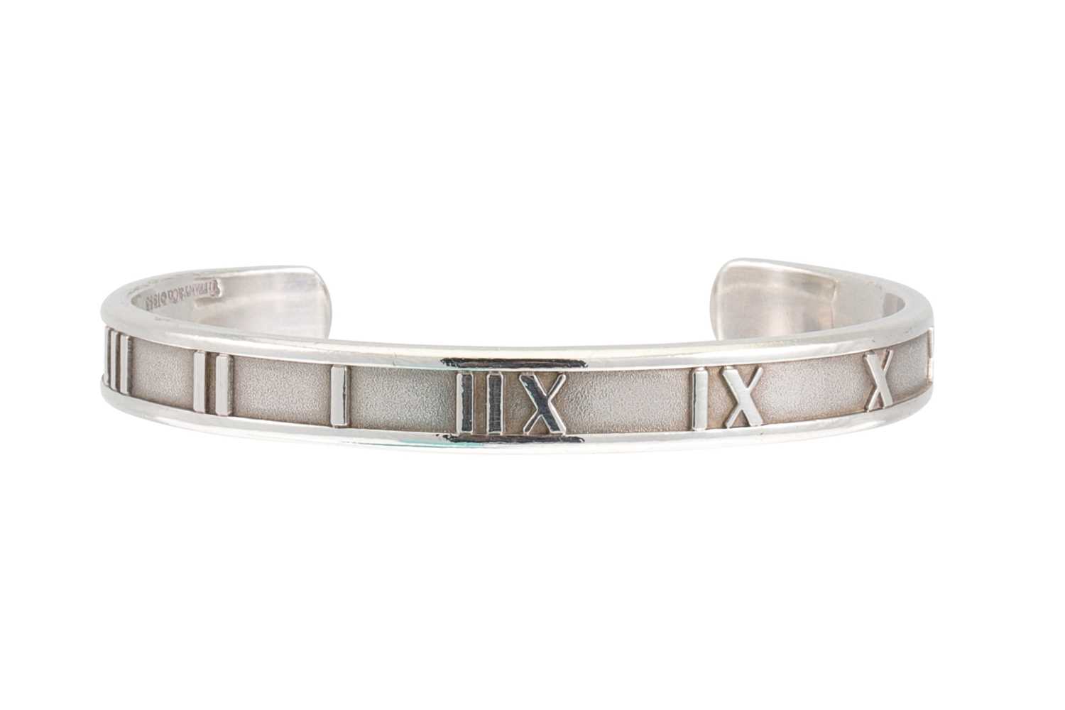 Lot 22 - A TIFFANY SILVER BRACELET, with Roman numerals,...