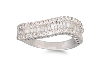 Lot 140 - A THREE ROWED DIAMOND RING, the brilliant cut...