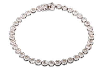 Lot 338 - A DIAMOND SET BRACELET, the collet set...