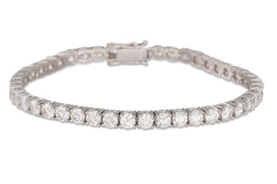 Lot 186 - A DIAMOND LINE BRACELET, the round brilliant...