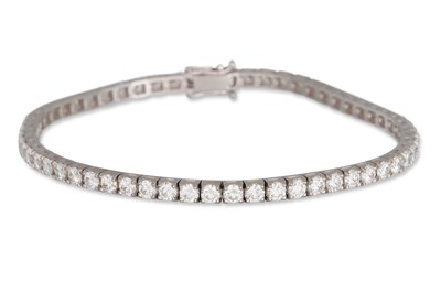 Lot 187 - A DIAMOND LINE BRACELET, the round brilliant...