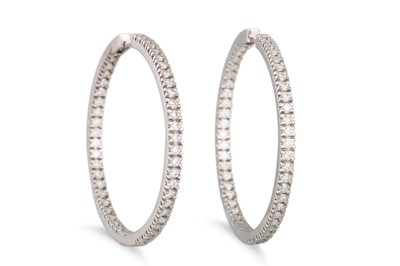 Lot 188 - A PAIR OF DIAMOND HOOP EARRINGS, the brilliant...