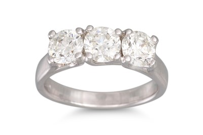 Lot 191 - A DIAMOND THREE STONE RING, the brilliant cut...