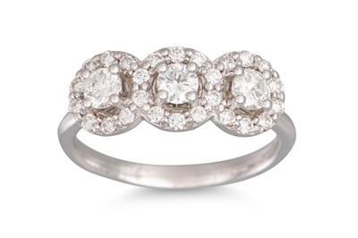 Lot 193 - A DIAMOND TRIPLE CLUSTER RING, set with...