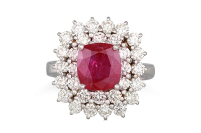 Lot 198 - A RUBY AND DIAMOND CLUSTER RING, the cushion...