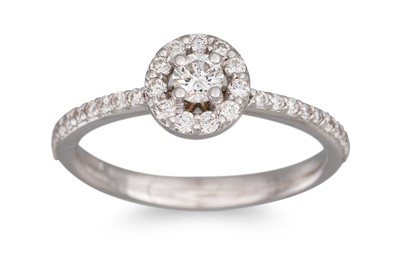 Lot 247 - A DIAMOND HALO CLUSTER RING, the brilliant cut...