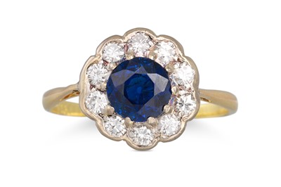 Lot 160 - A SAPPHIRE AND DIAMOND CLUSTER RING, of...