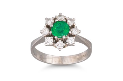 Lot 161 - AN EMERALD AND DIAMOND CLUSTER RING, of...