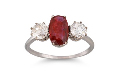 Lot 162 - A RUBY AND DIAMOND THREE STONE RING, the oval...