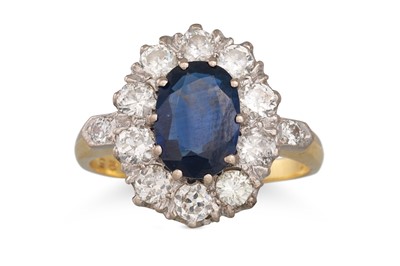 Lot 216 - A SAPPHIRE AND DIAMOND CLUSTER RING, oval...