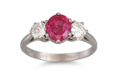 Lot 218 - A RUBY AND DIAMOND THREE STONE RING, the oval...