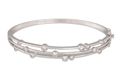 Lot 299 - A DIAMOND BANGLE, of waterfall design, in 18ct...