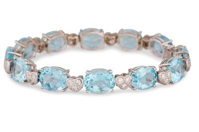 Lot 303 - A BLUE TOPAZ AND DIAMOND SET BRACELET, the...