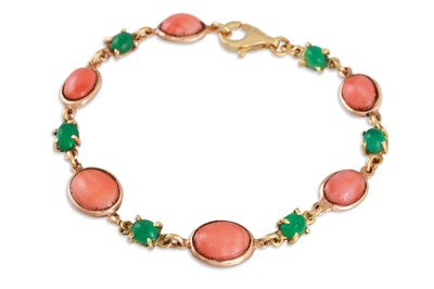 Lot 257 - A CORAL AND EMERALD BRACELET, the oval corals...