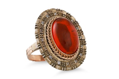 Lot 263 - AN AMBER AND DIAMOND RING, the oval amber to...