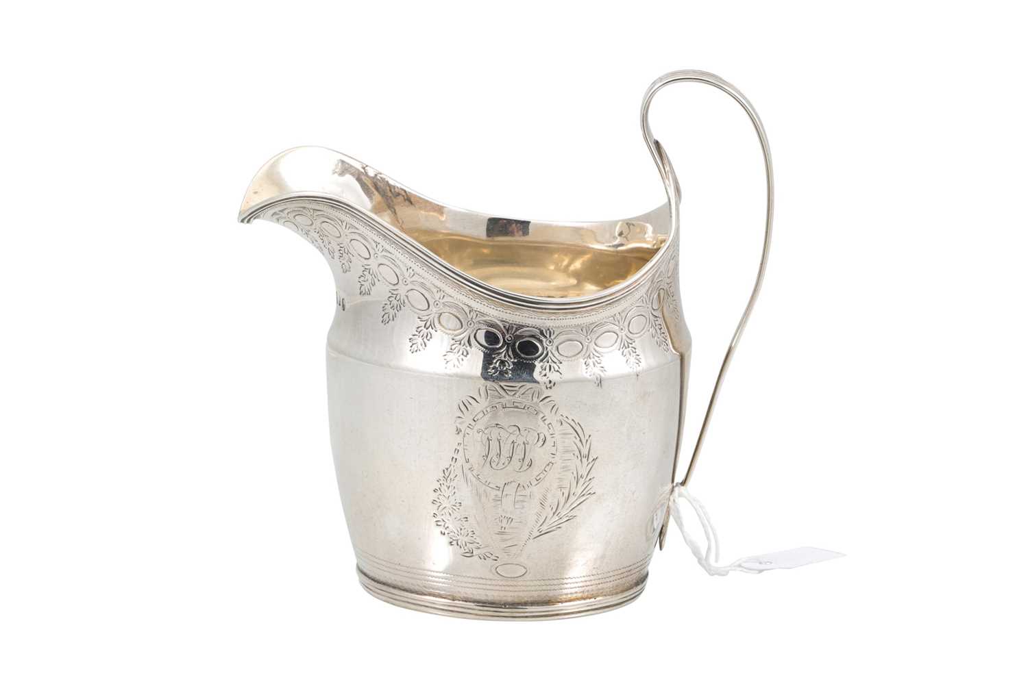 Lot 526 - A GEORGE III SILVER CREAM JUG, with engraved...