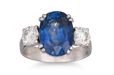 Lot 152 - A SAPPHIRE AND DIAMOND THREE STONE RING, the...