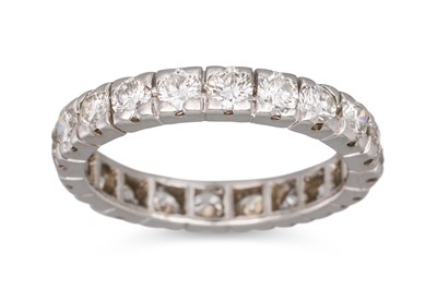 Lot 156 - A DIAMOND ETERNITY RING, the brilliant cut...