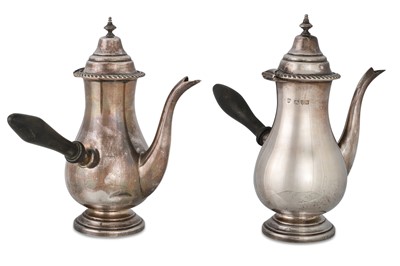 Lot 546 - A PAIR OF SILVER SIDE HANDLED COFFEE POTS, 556 g.