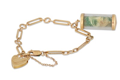 Lot 105 - A 9CT GOLD BRACELET, suspending a £1 charm and...