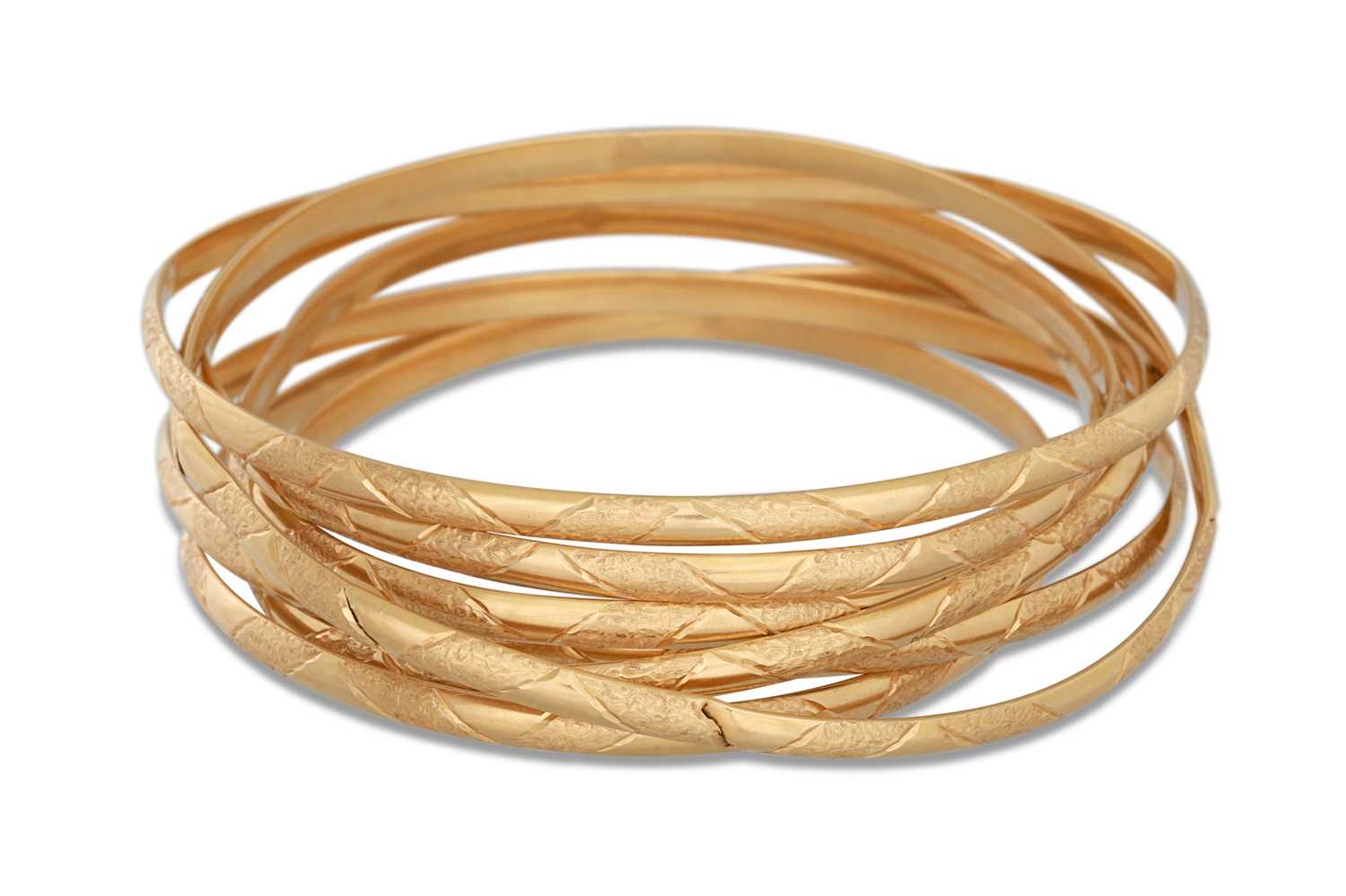 Lot 319 - SEVEN HANDMADE GOLD BANGLES, 18ct gold with...