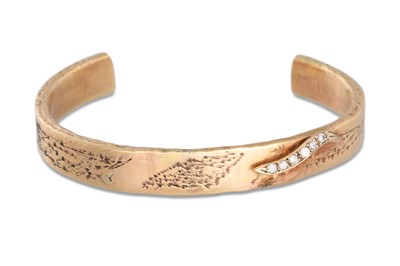 Lot 324 - A 9CT GOLD BANGLE, set with diamonds, brushed...