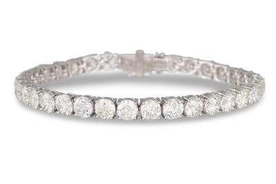 Lot 374 - A DIAMOND LINE BRACELET, the brilliant cut...