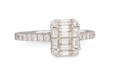 Lot 270 - A DIAMOND CLUSTER RING, the baguette cut...