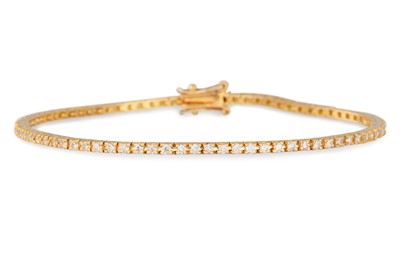 Lot 275 - A DIAMOND LINE BRACELET, the brilliant cut...