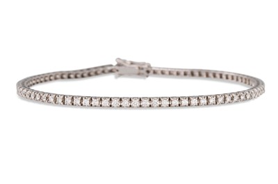 Lot 294 - A DIAMOND LINE BRACELET, the brilliant cut...