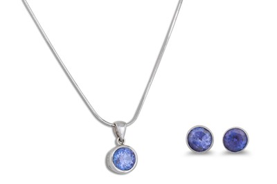 Lot 348 - A TANZANITE PENDANT, the collet set tanzanite...