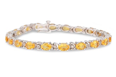 Lot 33 - A DIAMOND AND CITRINE BRACELET, mounted in...