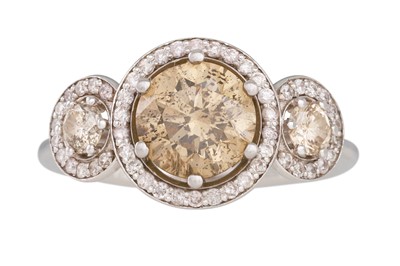 Lot 320 - A THREE STONE DIAMOND RING, mounted in 14ct...