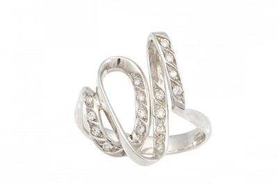 Lot 205 - A DIAMOND DRESS RING, of abstract swirl design,...