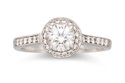 Lot 240 - A DIAMOND HALO CLUSTER RING, mounted in...