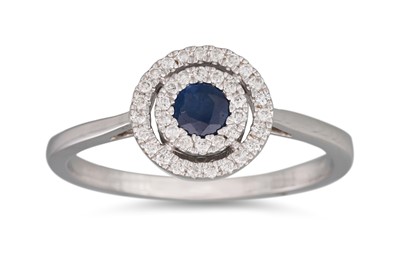 Lot 143 - A SAPPHIRE AND DIAMOND CLUSTER RING, the oval...