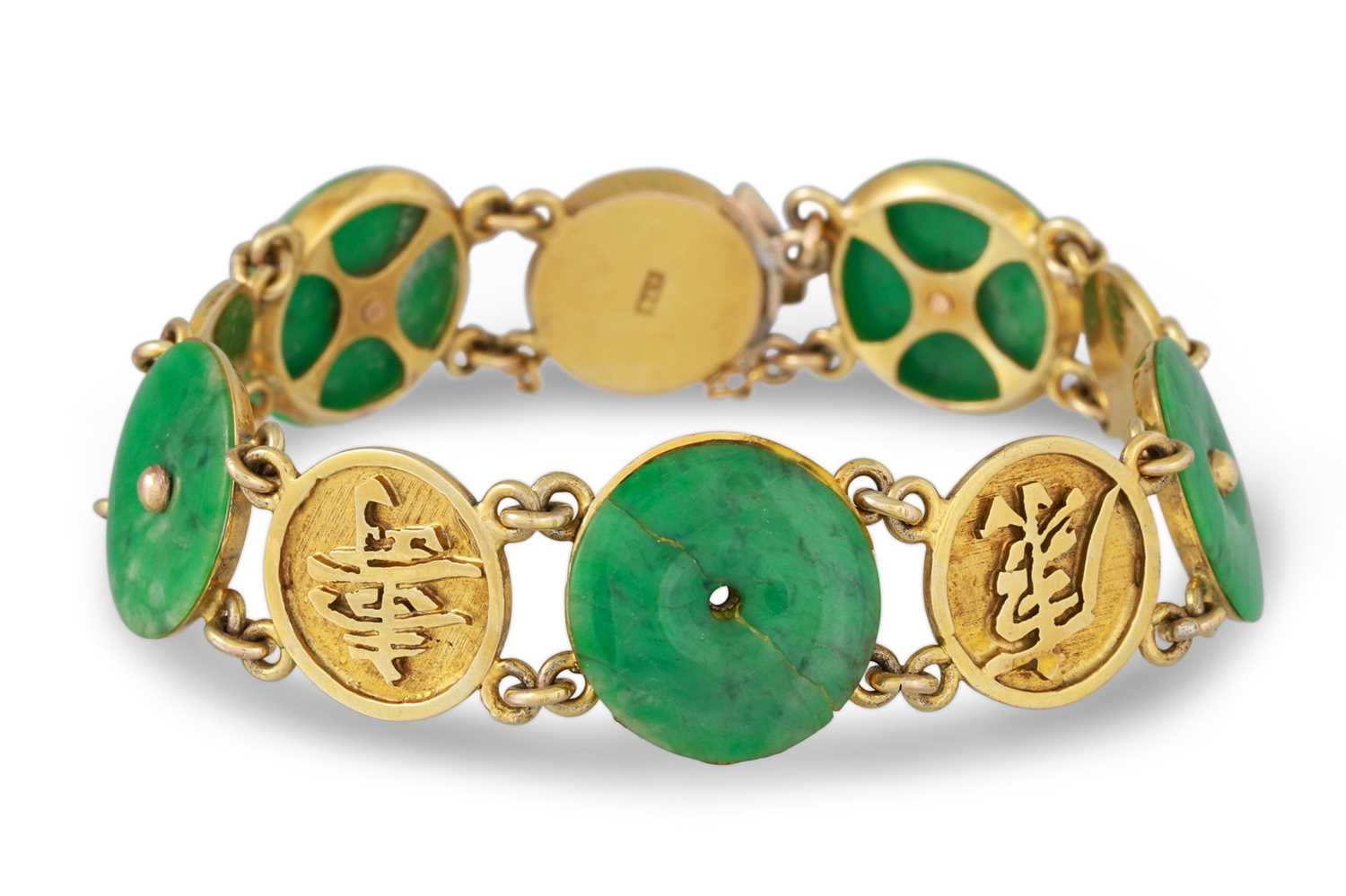 Lot 145 - A CHINESE JADE AND GOLD BRACELET, with...