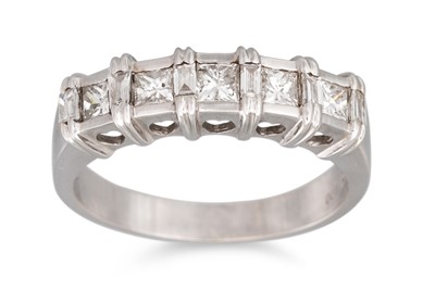 Lot 176 - A DIAMOND RING, set with princess cut diamonds...