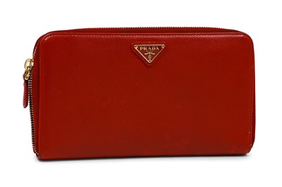 Lot 525 - A SAFFIANO PRADA WALLET, red leather, Prada...