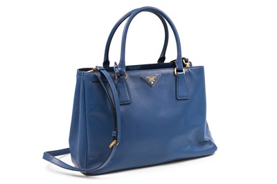 Lot 526 - A PRADA HANDBAG, mid-blue in colour,...