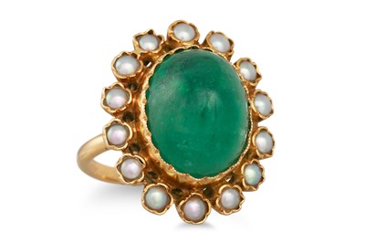 Lot 320 - A CABOCHON EMERALD AND PEARL RING, the oval...