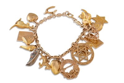 Lot 103 - A 9CT GOLD CHARM BRACELET, one silver charm...