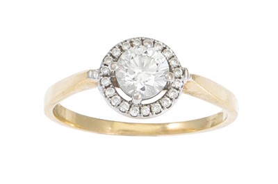 Lot 149 - A DIAMOND SOLITAIRE RING, of halo cluster...